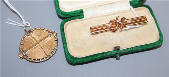 A yellow metal textured gold sun cross pendant (tests as 14ct) and a 15ct and pearl-set bar brooch